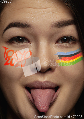 Image of Asian young woman\'s close up portrait on bright background, Tokyo 2020