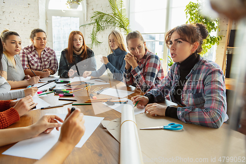 Image of Young people discussing about women rights and equality at the office