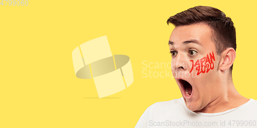 Image of Caucasian young man\'s close up portrait on bright background, Tokyo 2020