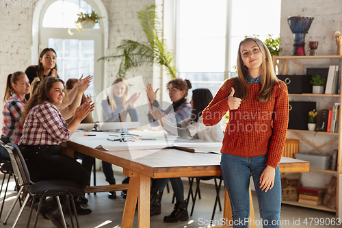 Image of Young people discussing about women rights and equality at the office