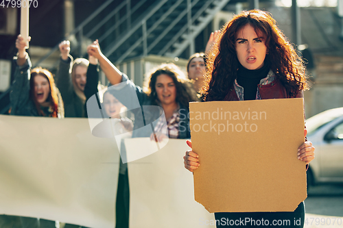 Image of Young people protesting of women rights and equality on the street