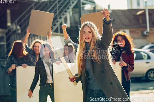 Image of Young people protesting of women rights and equality on the street