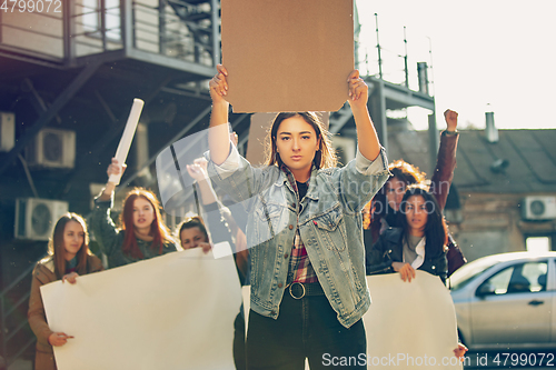 Image of Young people protesting of women rights and equality on the street