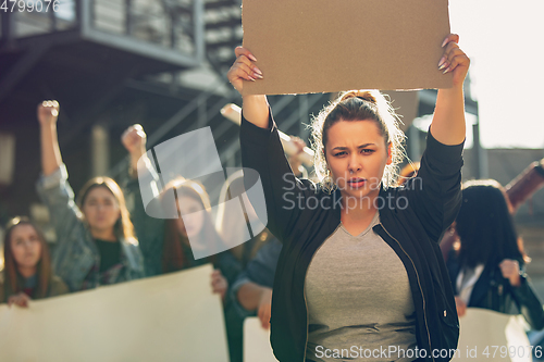 Image of Young people protesting of women rights and equality on the street