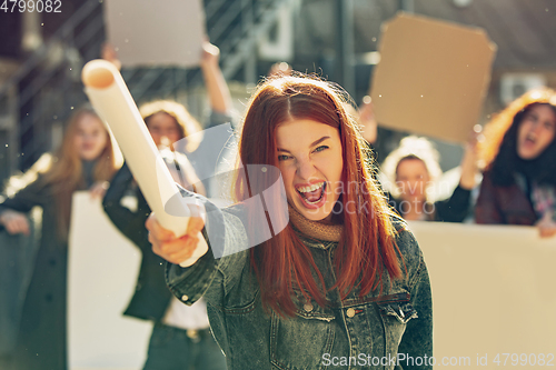 Image of Young people protesting of women rights and equality on the street