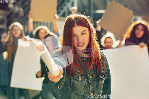 Image of Young people protesting of women rights and equality on the street