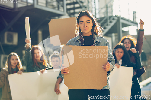 Image of Young people protesting of women rights and equality on the street