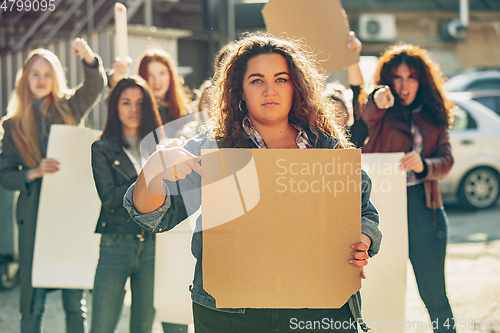 Image of Young people protesting of women rights and equality on the street