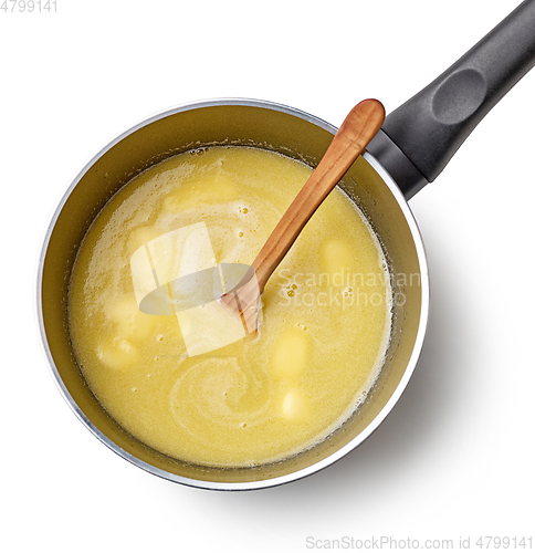 Image of water, melted butter and salt in a pot