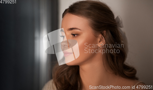 Image of portrait of young woman at home
