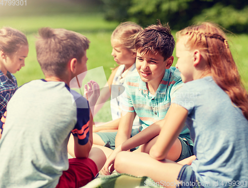 Image of group of happy kids or friends outdoors