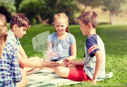 Image of happy kids playing rock-paper-scissors game