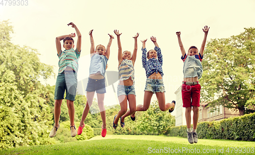 Image of happy kids jumping and having fun in summer park