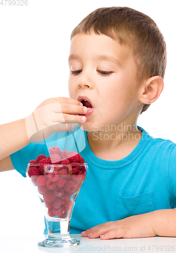 Image of Little boy with raspberries