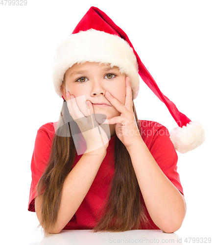 Image of Young unhappy girl in christmas cloth