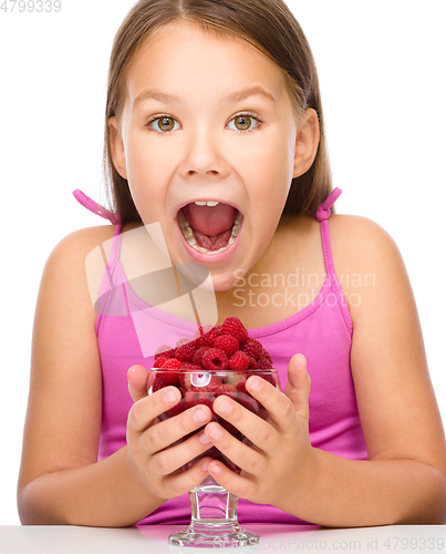 Image of Little girl with raspberries