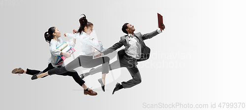 Image of Office workers or ballet dancers jumping on white background