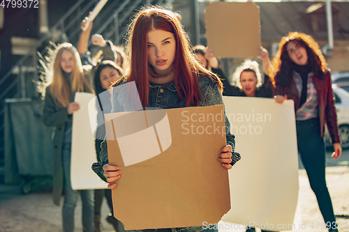 Image of Young people protesting of women rights and equality on the street