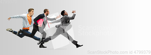 Image of Office workers or ballet dancers jumping on white background