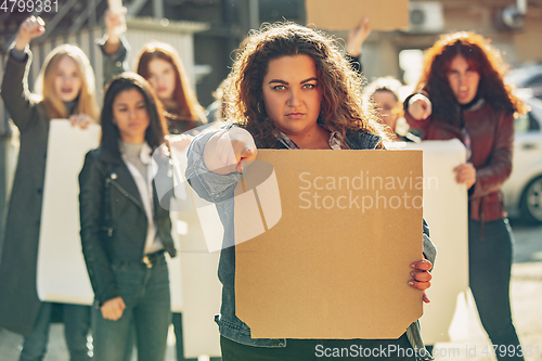 Image of Young people protesting of women rights and equality on the street