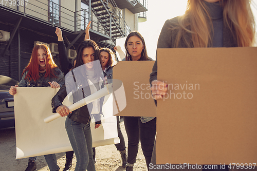 Image of Young people protesting of women rights and equality on the street