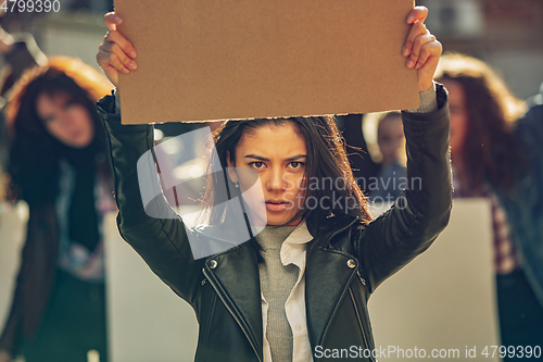 Image of Young people protesting of women rights and equality on the street