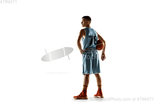 Image of Full length portrait of a young basketball player with ball