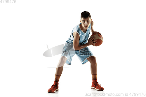 Image of Full length portrait of a young basketball player with ball