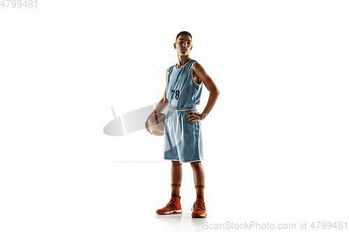 Image of Full length portrait of a young basketball player with ball