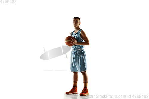 Image of Full length portrait of a young basketball player with ball