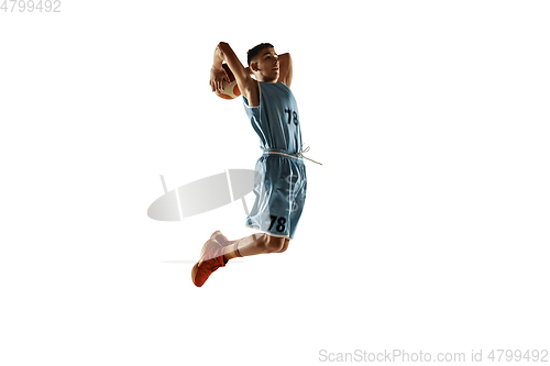 Image of Full length portrait of a young basketball player with ball