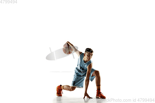 Image of Full length portrait of a young basketball player with ball