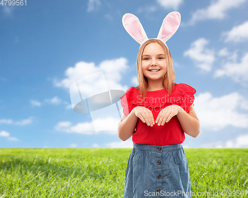 Image of happy girl wearing easter bunny ears headband