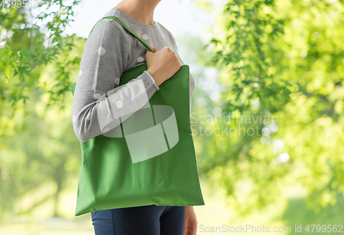 Image of woman with reusable canvas bag for food shopping