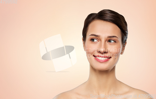 Image of beautiful smiling young woman with bare shoulder