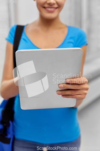 Image of student woman with bag and tablet computer