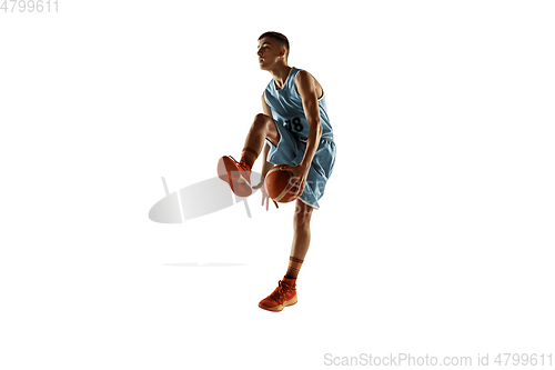 Image of Full length portrait of a young basketball player with ball