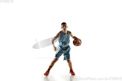 Image of Full length portrait of a young basketball player with ball