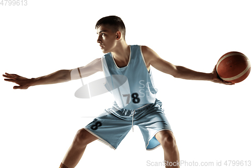 Image of Full length portrait of a young basketball player with ball