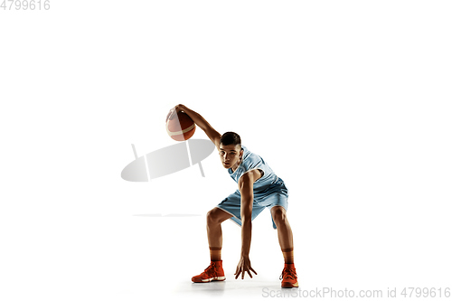 Image of Full length portrait of a young basketball player with ball