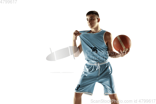 Image of Full length portrait of a young basketball player with ball