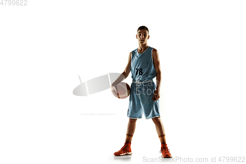 Image of Full length portrait of a young basketball player with ball