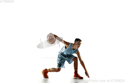 Image of Full length portrait of a young basketball player with ball
