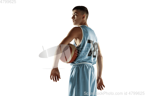 Image of Full length portrait of a young basketball player with ball