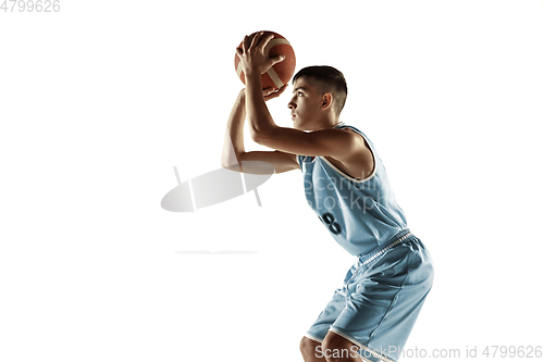 Image of Full length portrait of a young basketball player with ball