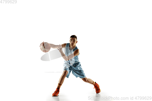 Image of Full length portrait of a young basketball player with ball