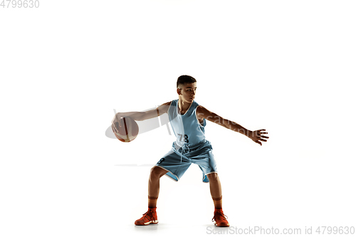 Image of Full length portrait of a young basketball player with ball