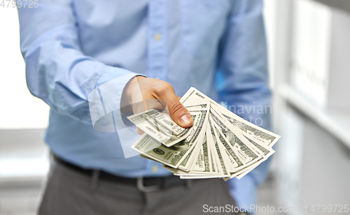 Image of close up of businessman with american dollar money