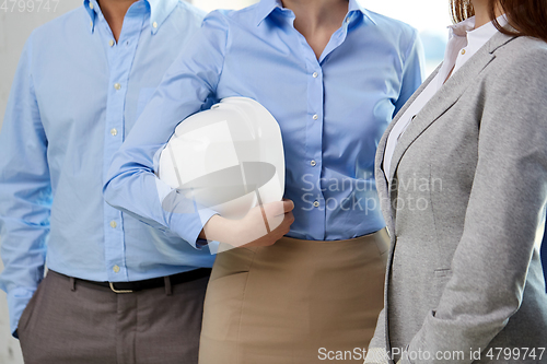 Image of close up of business team with hard hat