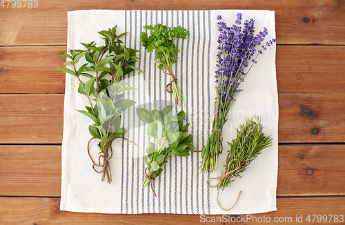 Image of greens, spices or medicinal herbs on towel